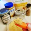 Baby carrot with peanut butter hummus and ingredients