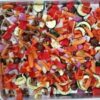 Colorful roasted vegetables on metal baking dish