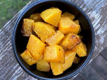 Air fried winter squash with wood background